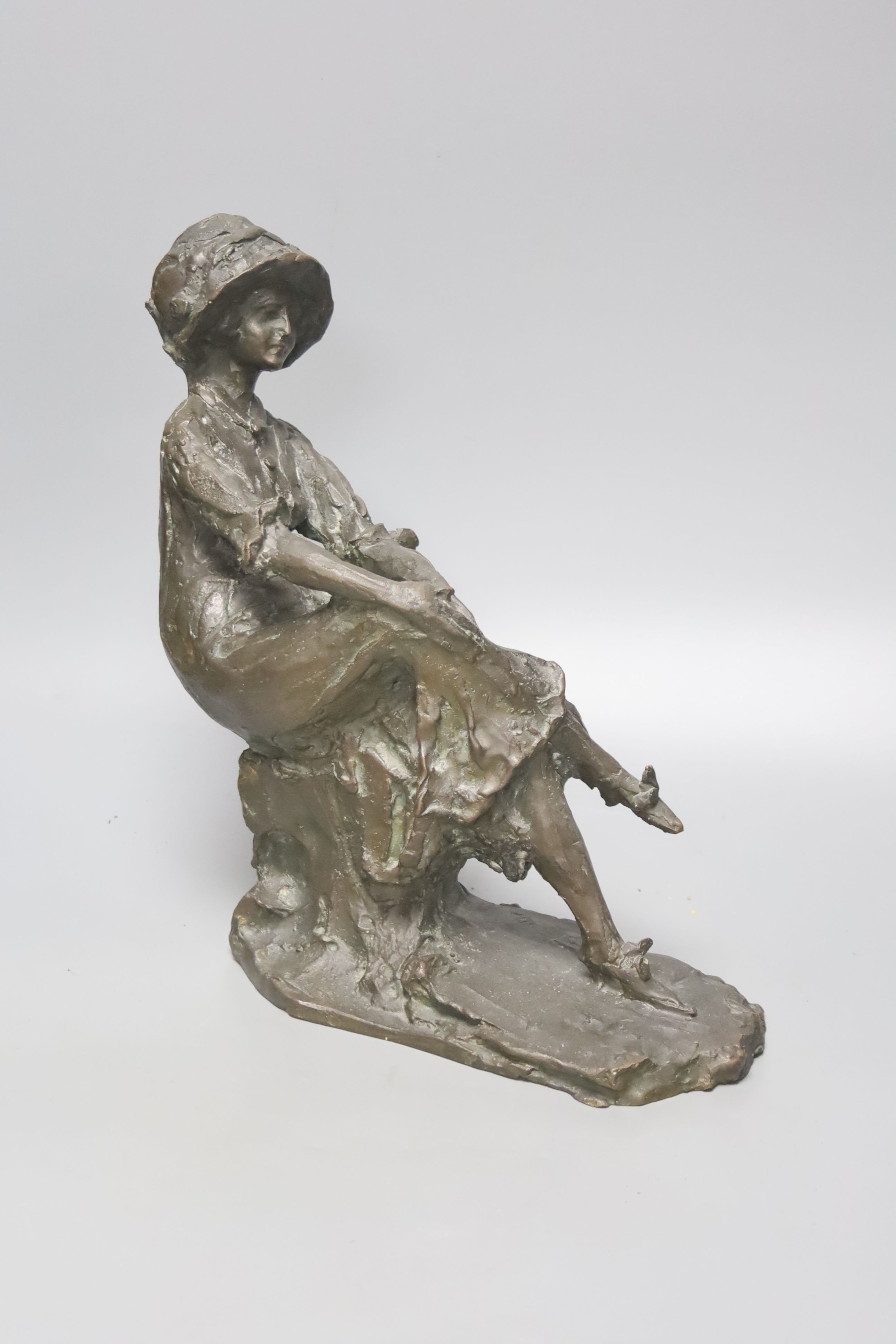 A Lost wax bronze of a seated lady, indistinctly signed, height 29cm